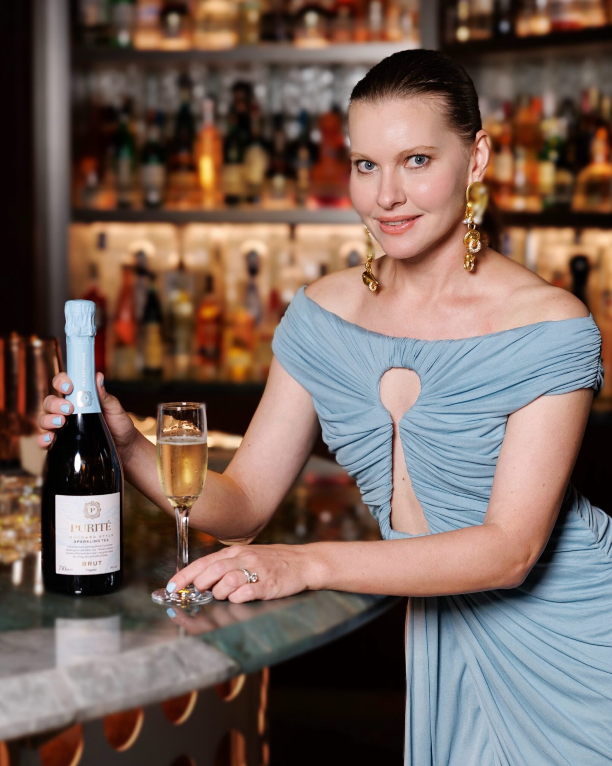 Tatiana Pudwill, founder of Purité, with a bottle of Purité Sparkling Tea